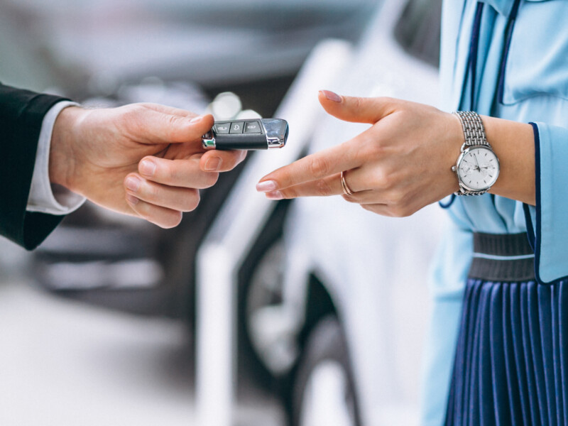 Female hands close up with car keys Female hands close up with car keys